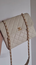 Load and play video in Gallery viewer, Chanel Cream Beige Square Flap Caviar 24k Gold
