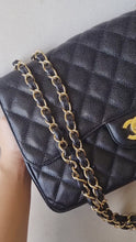 Load and play video in Gallery viewer, Chanel Jumbo Single Flap Black Caviar 24k Gold

