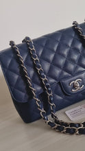 Load and play video in Gallery viewer, Chanel Jumbo Single Flap Navy Caviar Silver Hw
